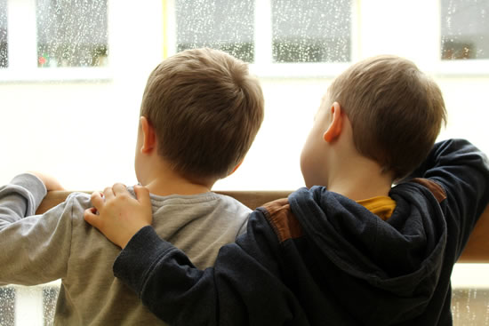 Footprints Foster Care - Children standing at window